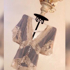 Beautiful low cut, lace trimmed, grey blouse